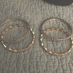 Silver and gold bracelets